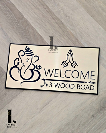 Modern acrylic Ganesha Namaste house number sign with intricate flute design beside front door.