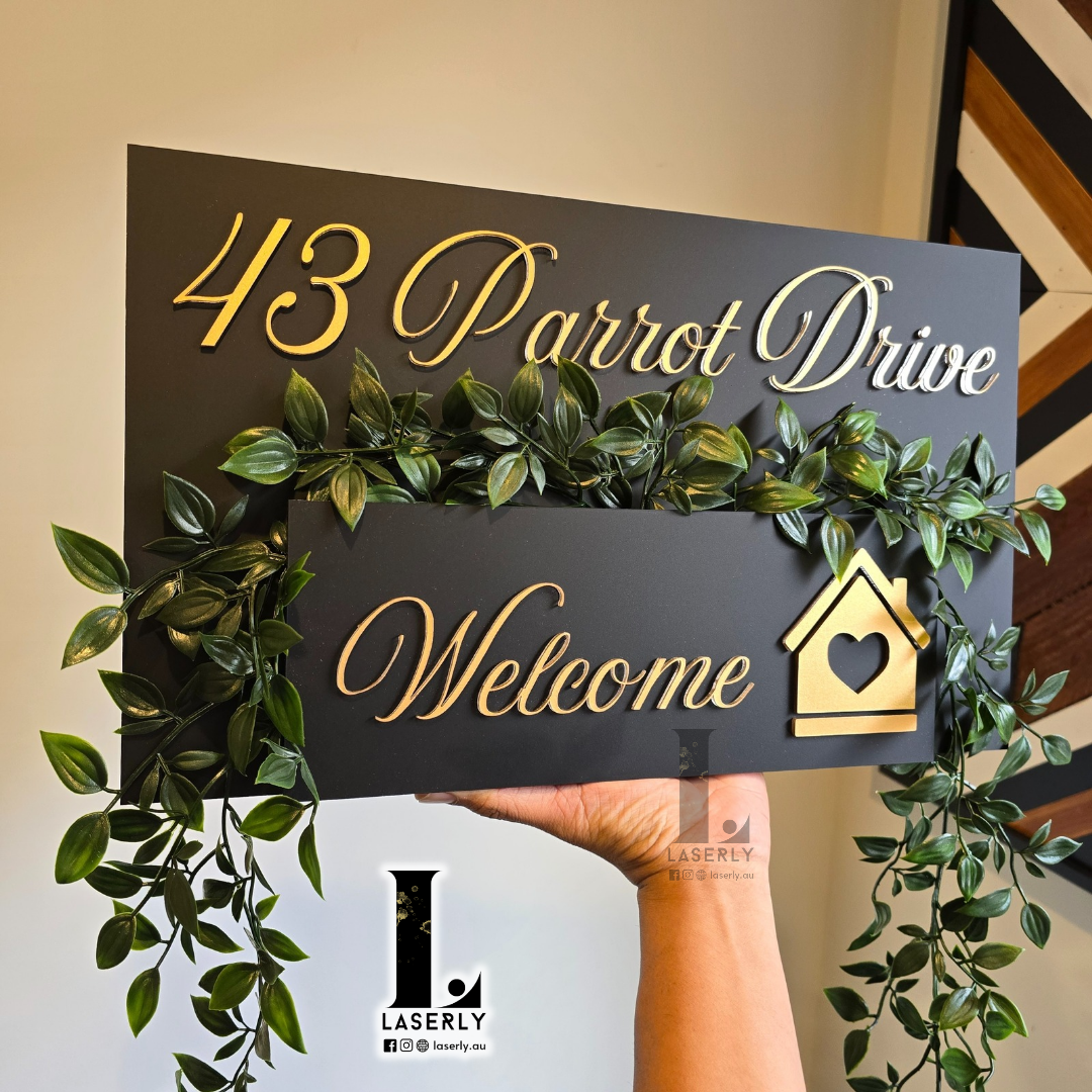 Outdoor wall-mounted planter featuring bold house numbers with decorative plants.