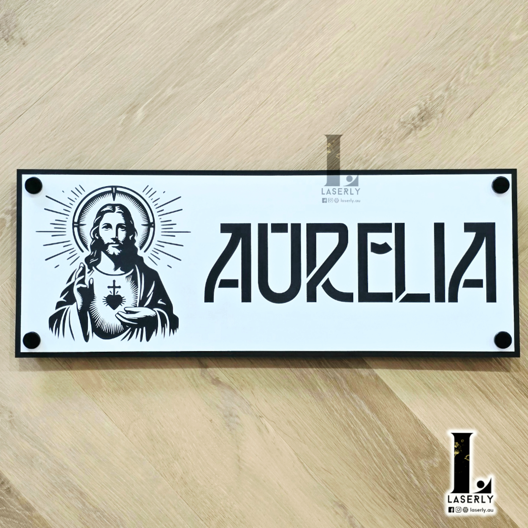 Personalised acrylic Jesus house name sign mounted beside a modern front door with elegant laser-cut detailing.