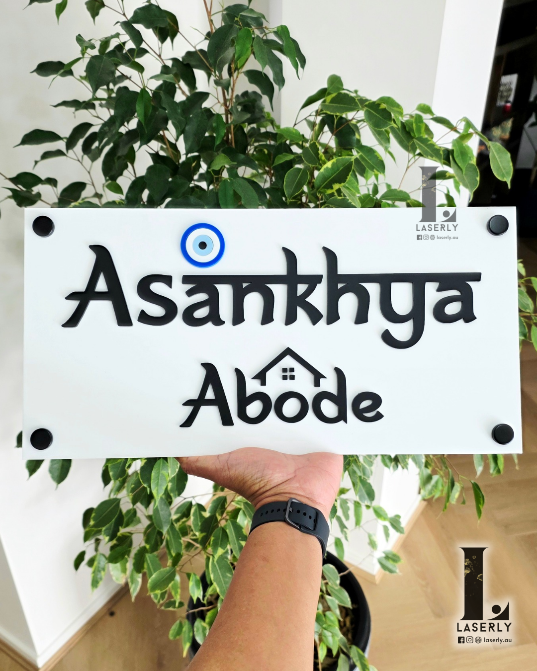 Modern acrylic home sign with evil eye design, perfect for entryway decoration.