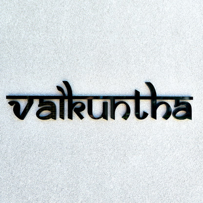 Custom wooden house name sign displayed above a front entrance.