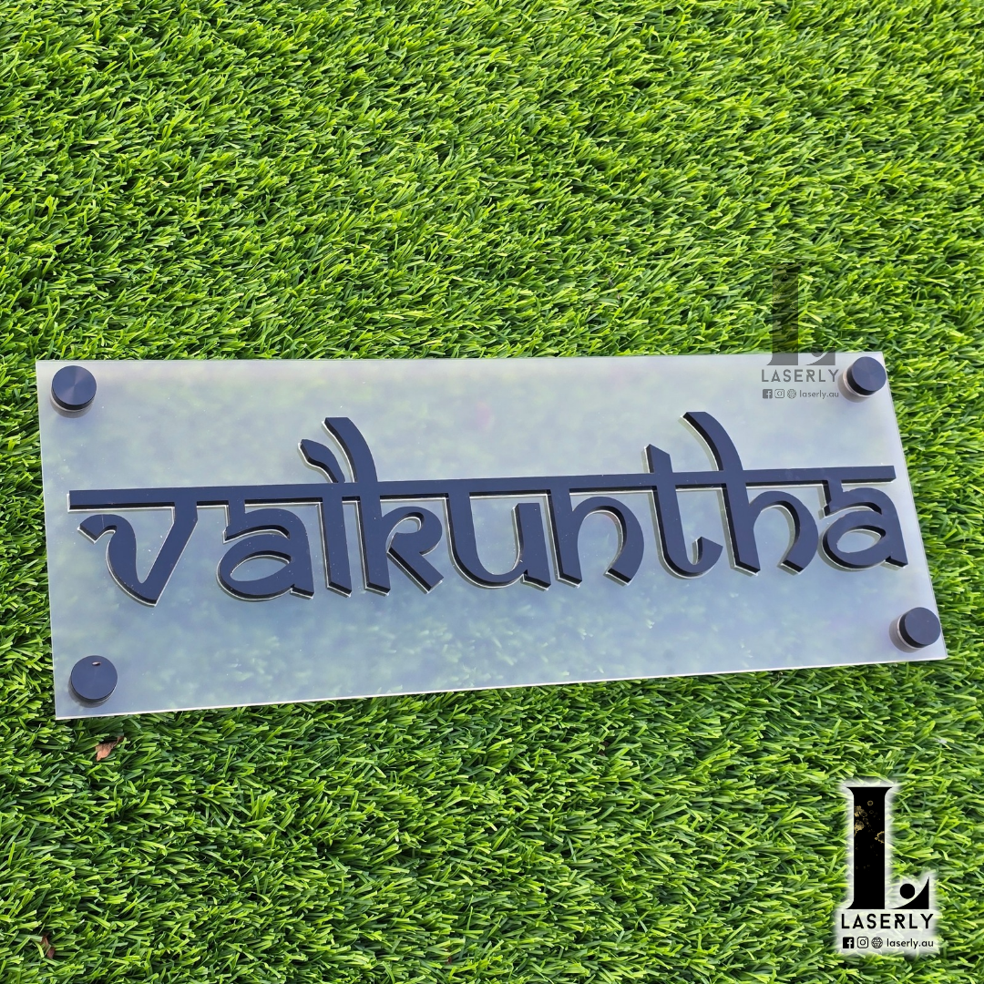 Personalized wooden house name plaque displayed at the entrance of a home.