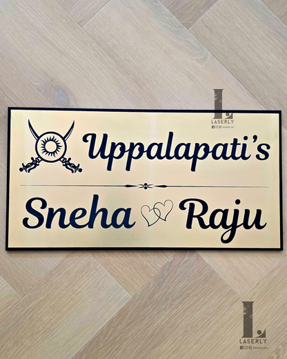 Modern Kshatriya house number sign mounted beside front door on exterior wall.