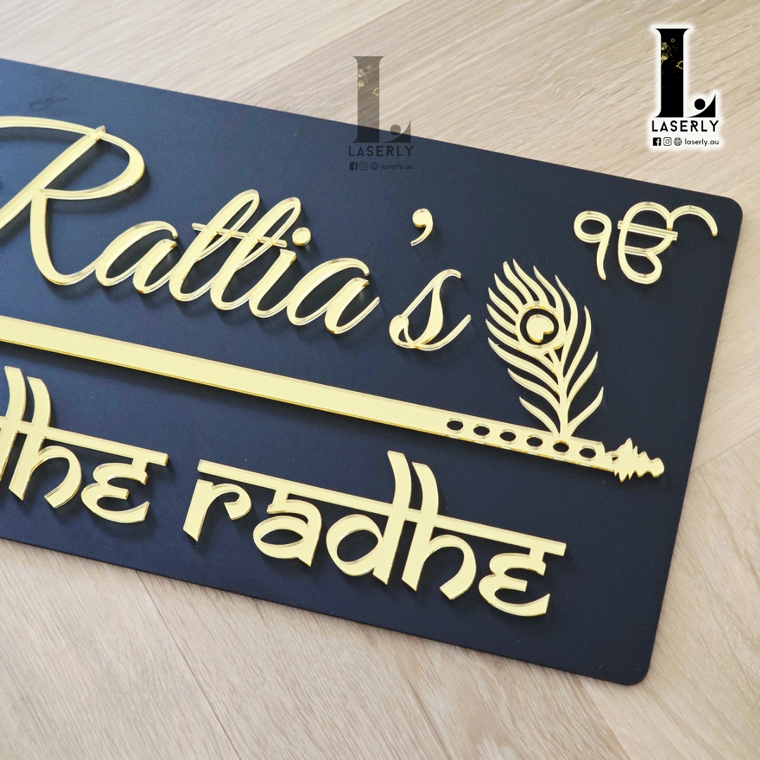 Contemporary black house number plate combining elegant flute design and symbolic evil eye charm.