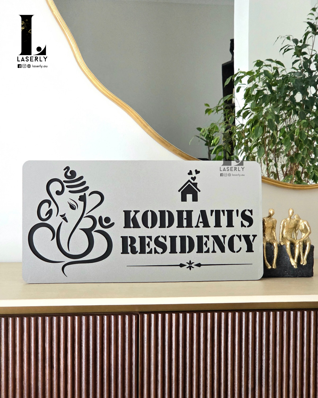 Elegant steel-look Ganesha house number sign featuring bold numerals and detailed deity design.