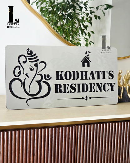Premium acrylic Ganesha house number plate with brushed steel effect for main entrance décor.