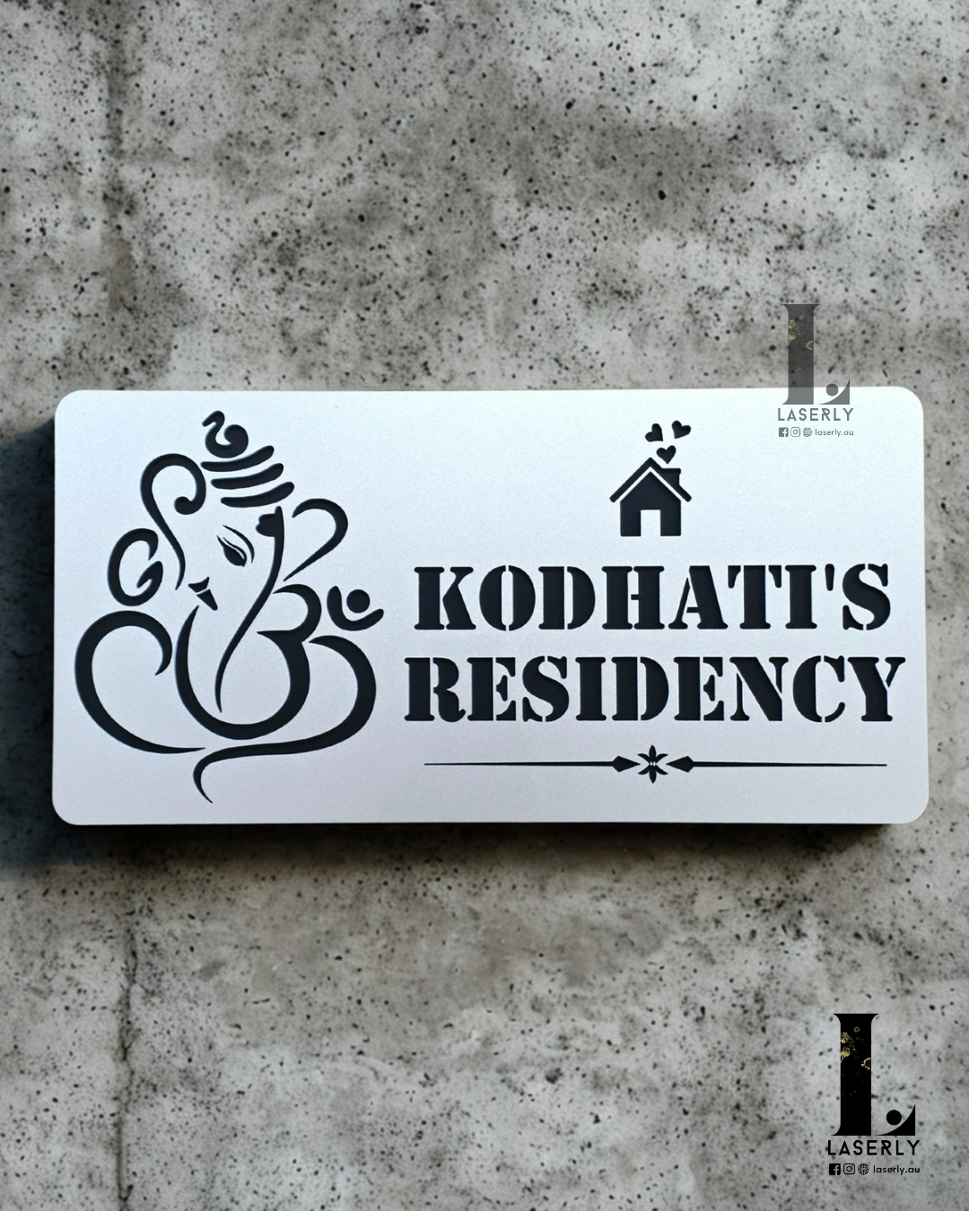 Contemporary Ganesha address sign crafted in steel-finish acrylic, installed next to doorway.