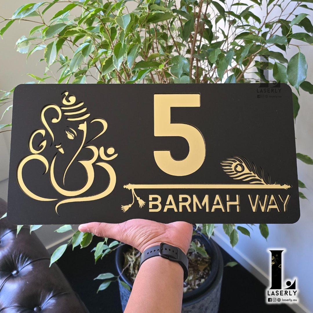 Contemporary home exterior with Ganesha-Krishna themed decorative number sign.