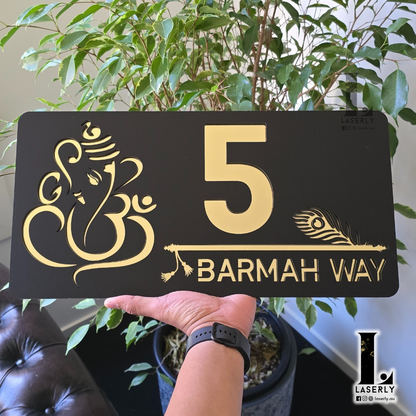 Contemporary home exterior with Ganesha-Krishna themed decorative number sign.