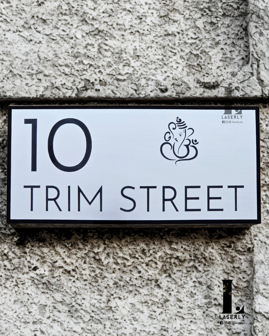 Elegant laser-cut Ganesha house number sign enhancing home entrance décor.
