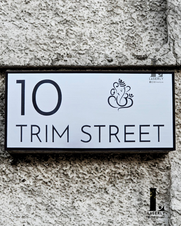 Elegant laser-cut Ganesha house number sign enhancing home entrance décor.