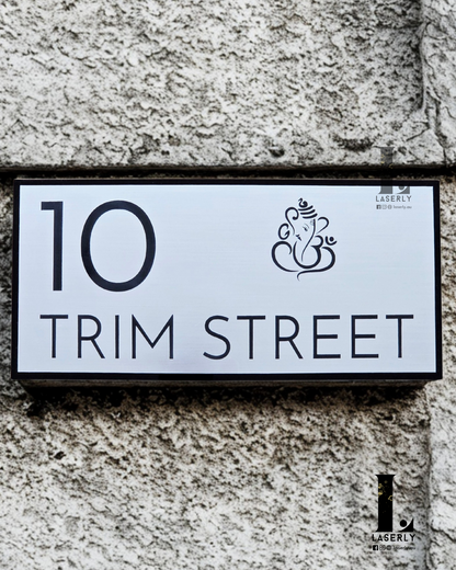 Elegant laser-cut Ganesha house number sign enhancing home entrance décor.