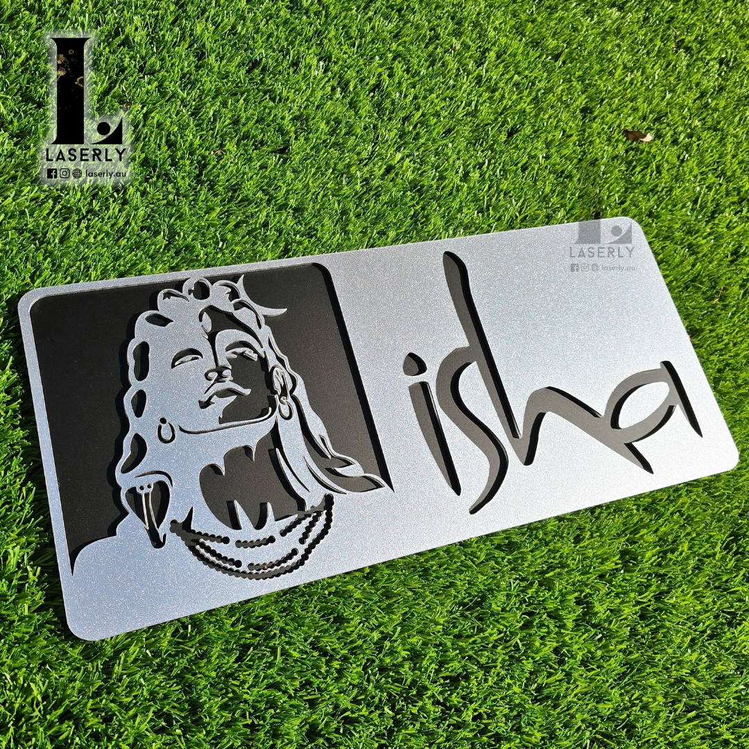 Custom Isha house number sign in sleek acrylic finish installed on exterior wall.