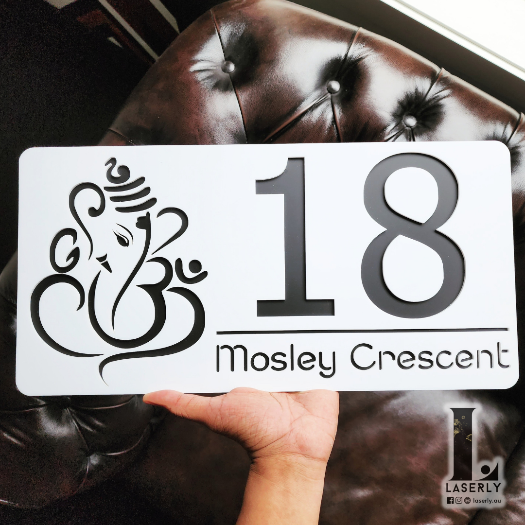 Decorative Ganesha-themed house number sign with sleek matte finish.