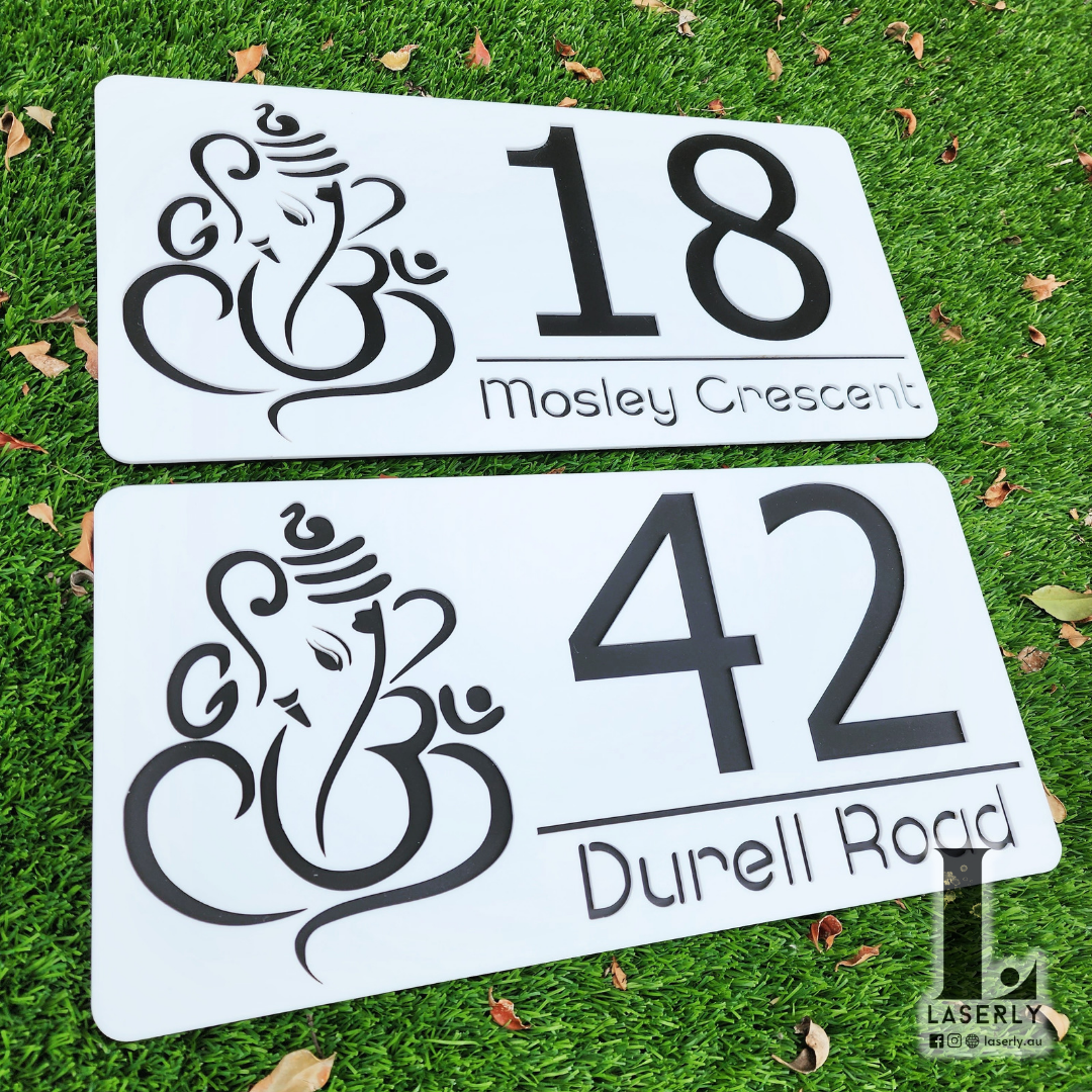 Elegant wall-mounted Ganesha house number sign for home entrance.