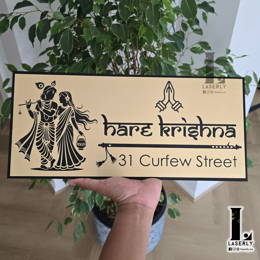 Modern Radhe Krishna house number sign with intricate detailing displayed at the front entryway.