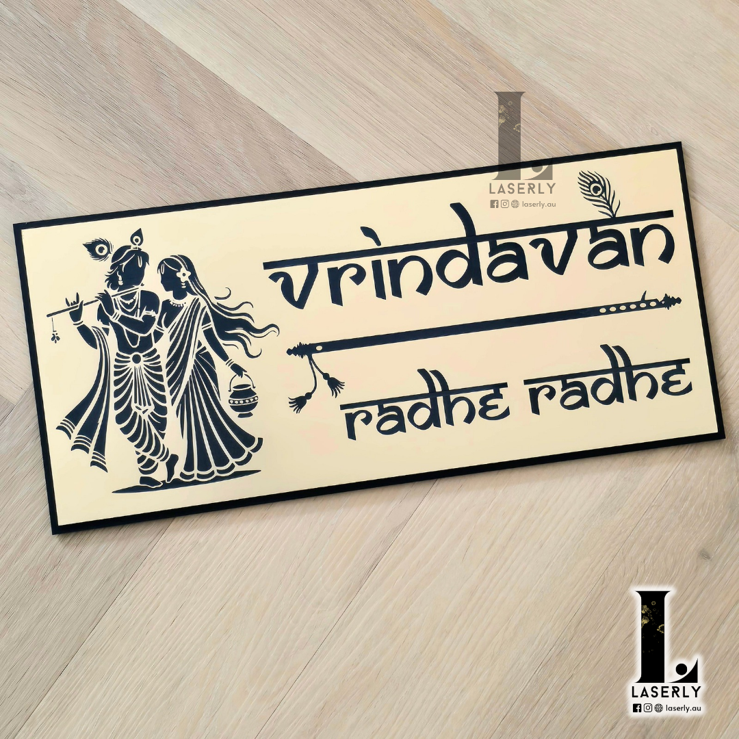 Decorative Radhe Krishna Vrindhavan name and house number sign installed at residential entryway.