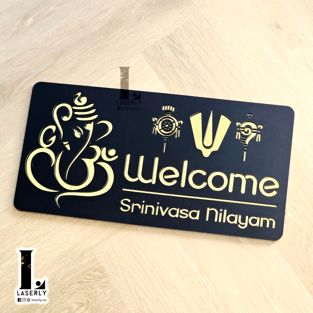 Custom Srinivasa house name and number sign with elegant acrylic finish on exterior wall.