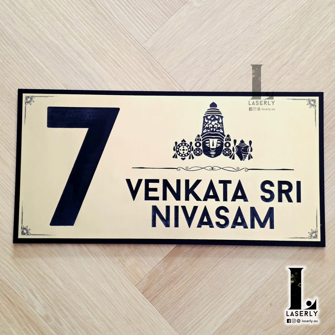 Elegant Thirumala home number plaque displayed beside the front door.