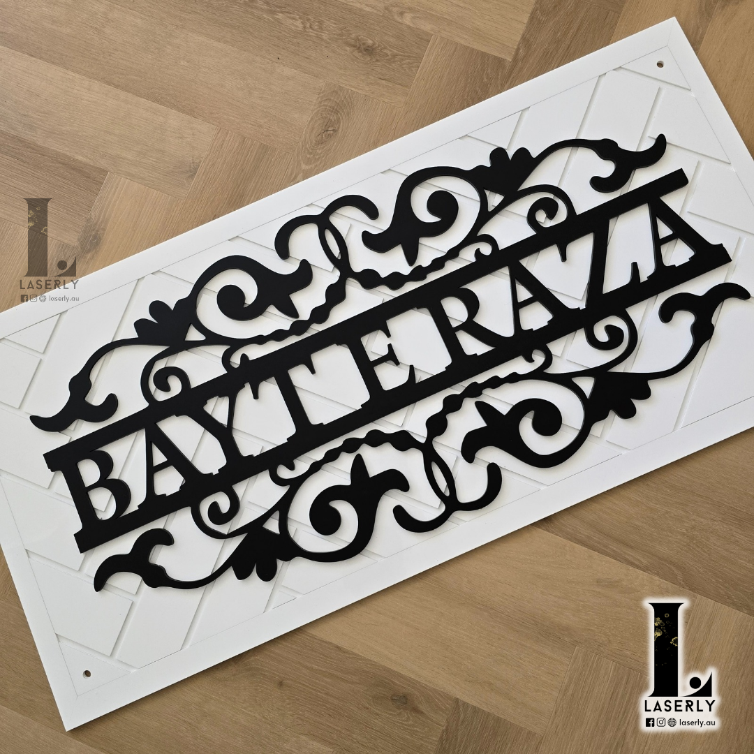Modern white patterned wall sign displaying house name, ideal for outdoor décor.